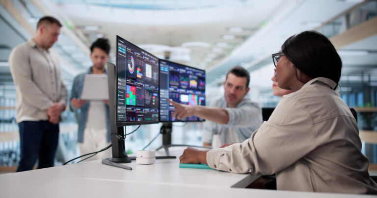 Multiracial Team Predicting Performance Using Analytic Dashboard On Desktop